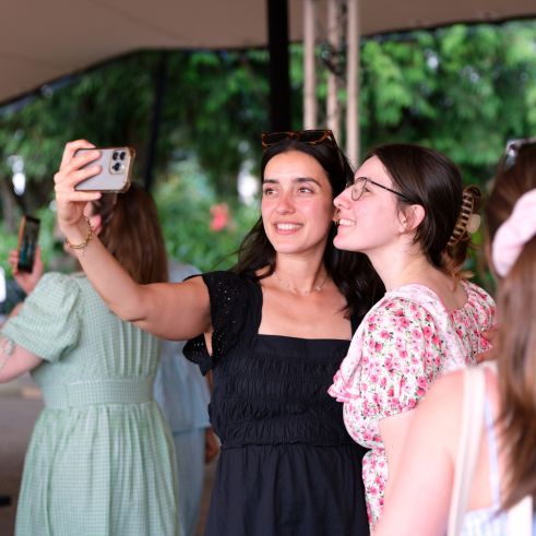 N team mates taking a selfie with a phone