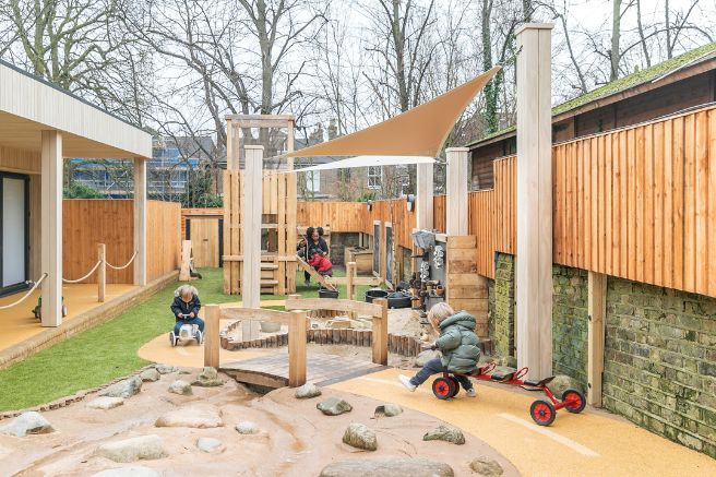 Children playing in a nursery garden
