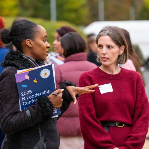 N managers chatting at the annual leadership conference